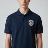 Polo pour écussons amovibles